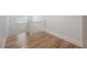 Bright staircase features hardwood flooring and white banisters at 622 S Ingraham Ave, Lakeland, FL 33801
