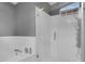Modern bathroom boasts seamless glass shower door and tub at 625 Nighthawk Cir, Winter Springs, FL 32708
