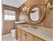 Bathroom featuring a decorative mirror and vanity at 625 Nighthawk Cir, Winter Springs, FL 32708
