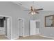 Neutral bedroom boasts lots of natural light and ceiling fan at 625 Nighthawk Cir, Winter Springs, FL 32708