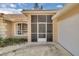 Close-up of screened front entryway next to garage at 625 Nighthawk Cir, Winter Springs, FL 32708