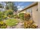 Lush landscaping with stepping stones, colorful plants, and a well-maintained lawn at 625 Nighthawk Cir, Winter Springs, FL 32708