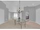 Open-concept living and dining area with contemporary lighting and neutral color palette at 625 Nighthawk Cir, Winter Springs, FL 32708