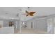 Spacious living room featuring vaulted ceilings, neutral colors, with a decorative ceiling fan at 625 Nighthawk Cir, Winter Springs, FL 32708