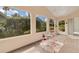 Relaxing sunroom with tiled floors and views of greenery at 625 Nighthawk Cir, Winter Springs, FL 32708