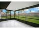 Enclosed patio with tile flooring, offering an outdoor living space with views of the fenced backyard at 7609 Winter Shade Dr, Orlando, FL 32822