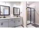 Spacious bathroom features dual vanities, granite countertops, black hardware, and a walk-in shower at 7951 Haverhill Way, Kissimmee, FL 34747