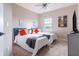 Comfortable bedroom featuring two twin beds with blue headboards and coordinating gray accents at 7951 Haverhill Way, Kissimmee, FL 34747