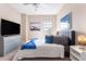 Well-appointed bedroom boasting a serene atmosphere, ample lighting, and a functional layout at 7951 Haverhill Way, Kissimmee, FL 34747