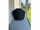 Covered outdoor grill on a concrete patio, providing an ideal space for barbecuing and entertaining at 7951 Haverhill Way, Kissimmee, FL 34747
