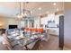 Bright and airy dining area adjacent to the modern kitchen, with stylish seating for a delightful experience at 7951 Haverhill Way, Kissimmee, FL 34747