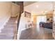Inviting foyer with hardwood-style floors and staircase leading to the upper level of the home at 7951 Haverhill Way, Kissimmee, FL 34747