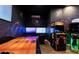 Fun game room with cosmic wall mural, air hockey, flat screen televisions and arcade games at 7951 Haverhill Way, Kissimmee, FL 34747