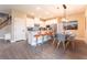 Modern eat-in kitchen featuring white cabinets, stainless steel appliances, a kitchen island, and stylish furnishings at 7951 Haverhill Way, Kissimmee, FL 34747