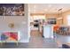 Modern eat-in kitchen featuring white cabinets, stainless steel appliances, and an island with room for seating at 7951 Haverhill Way, Kissimmee, FL 34747