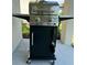 Stainless steel outdoor grill on a concrete patio, perfect for outdoor cooking and entertaining at 7951 Haverhill Way, Kissimmee, FL 34747
