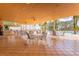 Outdoor patio seating with ample tables, chairs and a pool view for dining and socializing at 7951 Haverhill Way, Kissimmee, FL 34747