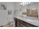This bathroom offers granite countertops, dual sinks, and tile flooring at 8615 N Rindge Rd, Polk City, FL 33868