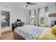 This bedroom offers natural light, neutral walls, wood-look flooring and a ceiling fan at 8615 N Rindge Rd, Polk City, FL 33868