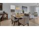 Inviting dining area featuring a chandelier, natural light and open space to a living room area at 8615 N Rindge Rd, Polk City, FL 33868