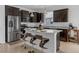 Modern kitchen with stainless steel appliances, granite countertops, ample cabinet space, and island seating at 8615 N Rindge Rd, Polk City, FL 33868