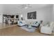 Open concept living room with kitchen and dining area, perfect for modern living and entertaining at 8615 N Rindge Rd, Polk City, FL 33868