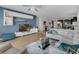 Open-concept living room with modern decor, wood floors, comfortable seating, and abundant natural light at 8615 N Rindge Rd, Polk City, FL 33868