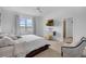 This main bedroom offers neutral walls, carpet flooring, a ceiling fan, and natural light at 8615 N Rindge Rd, Polk City, FL 33868