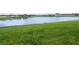 View of the community pond from the lawn at 8615 N Rindge Rd, Polk City, FL 33868