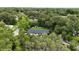 Lovely aerial view of home nestled among lush trees and landscaped yard at 897 Shed St, Oviedo, FL 32765