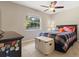 Comfortable bedroom with large window allowing natural light to fill the room at 897 Shed St, Oviedo, FL 32765