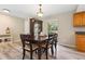 Dining area with hardwood floors featuring classic lighting and a full-sized table at 897 Shed St, Oviedo, FL 32765