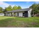 Charming home featuring classic design and well-manicured front lawn at 897 Shed St, Oviedo, FL 32765