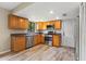 Modern kitchen featuring stainless steel appliances, wood cabinets, and ample countertop space at 897 Shed St, Oviedo, FL 32765