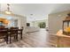 Inviting living room with hardwood floors, open to kitchen, and sliding glass doors to backyard at 897 Shed St, Oviedo, FL 32765