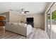 Bright and airy living room with sliding doors leading to backyard, ample natural light and hardwood floors at 897 Shed St, Oviedo, FL 32765