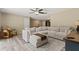 Bright living room featuring an oversized sectional sofa and stylish decor at 897 Shed St, Oviedo, FL 32765