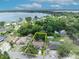 An aerial view showing property lines around a single-Gathering home, surrounded by mature trees near the lake at 906 25Th Nw St, Winter Haven, FL 33881