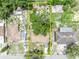 Aerial view showcasing the property, surrounding trees, and layout of the home and neighborhood at 906 25Th Nw St, Winter Haven, FL 33881