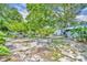 Expansive backyard featuring various fruit trees, greenery and shaded areas for outdoor enjoyment at 906 25Th Nw St, Winter Haven, FL 33881