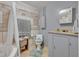 Bathroom with a walk-in shower, toilet, vanity, and tile flooring at 906 25Th Nw St, Winter Haven, FL 33881