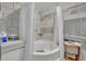 Bathroom featuring a walk-in shower, toilet, and tile flooring at 906 25Th Nw St, Winter Haven, FL 33881