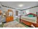 Bedroom featuring a wooden bed frame, dresser, and a light colored rug at 906 25Th Nw St, Winter Haven, FL 33881