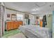 Bedroom with a wooden dresser, bed and green flooring at 906 25Th Nw St, Winter Haven, FL 33881