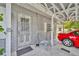 Welcoming entrance with a screened door, complemented by a covered carport for convenient parking and protection from the elements at 906 25Th Nw St, Winter Haven, FL 33881