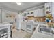 Functional kitchen with essential appliances, offering a practical space for meal preparation and everyday cooking tasks at 906 25Th Nw St, Winter Haven, FL 33881