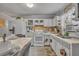 Practical kitchen with essential appliances, featuring a cozy dining area for casual meals and everyday use, bright and functional at 906 25Th Nw St, Winter Haven, FL 33881