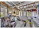 Enclosed sunroom featuring a painted wood floor and miscellaneous decor throughout the space at 906 25Th Nw St, Winter Haven, FL 33881
