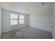 Bright, carpeted bedroom with two large windows offering plenty of natural light at 9199 Waverly Walk Dr, Orlando, FL 32817