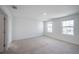 Large bright bedroom with neutral carpet and two windows for natural light at 9199 Waverly Walk Dr, Orlando, FL 32817